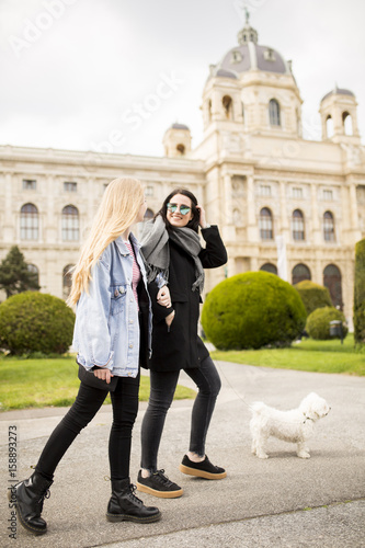 Beautiful happy women walki...