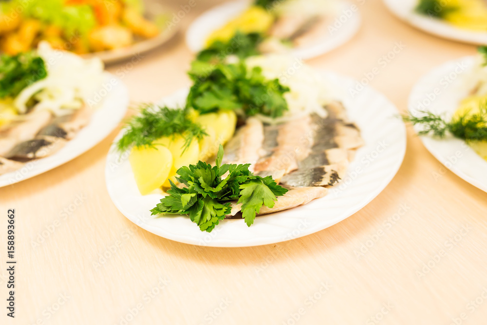 Dish with sliced fish products on the festive table Dish with sliced fish products on the festive table