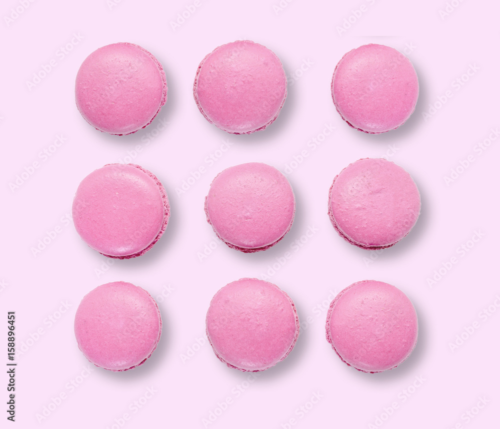 Obraz premium Pink macaroons on pink background