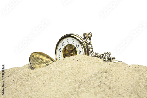 Pocket watch in sand