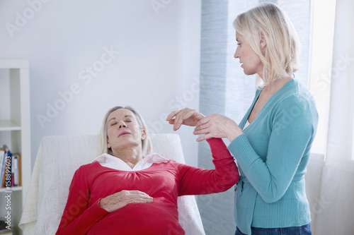 Senior woman undergoing hypnosis session