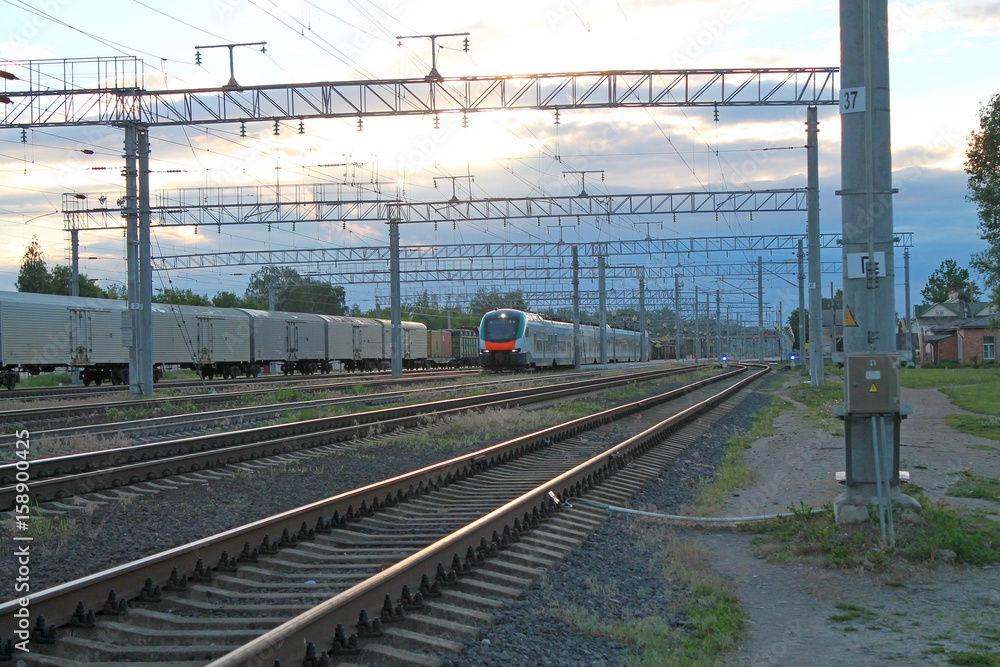 modern train riding on rails along the train station
