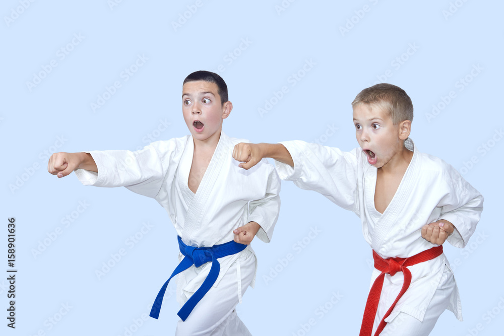 Karate boys are beating punches Karate boys are beating punches