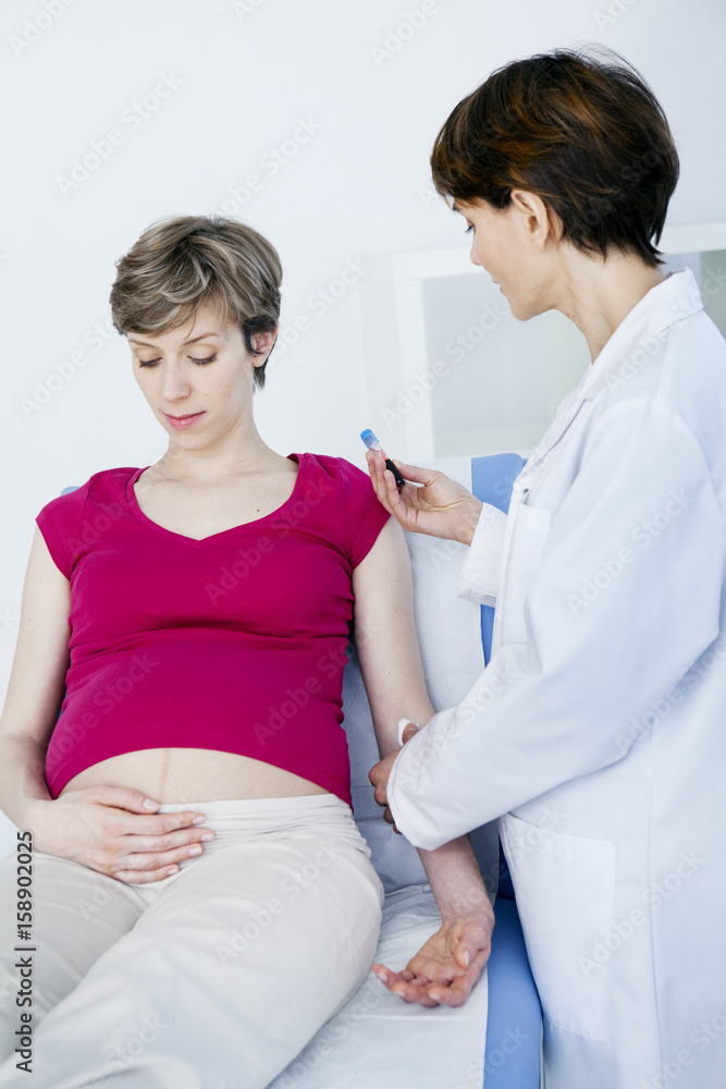 Fototapeta premium Blood sample being taken from pregnant woman