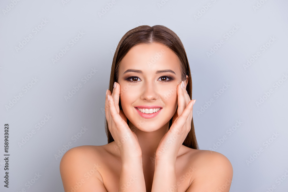 Beauty and health concept. Young attractive girl is touching gently her attractive healthy smooth skin, looking straight in the camera. So fresh, attractive and healthy Beauty and health concept. Young attractive girl is touching gently her attractive healthy smooth skin, looking straight in the camera. So fresh, attractive and healthy