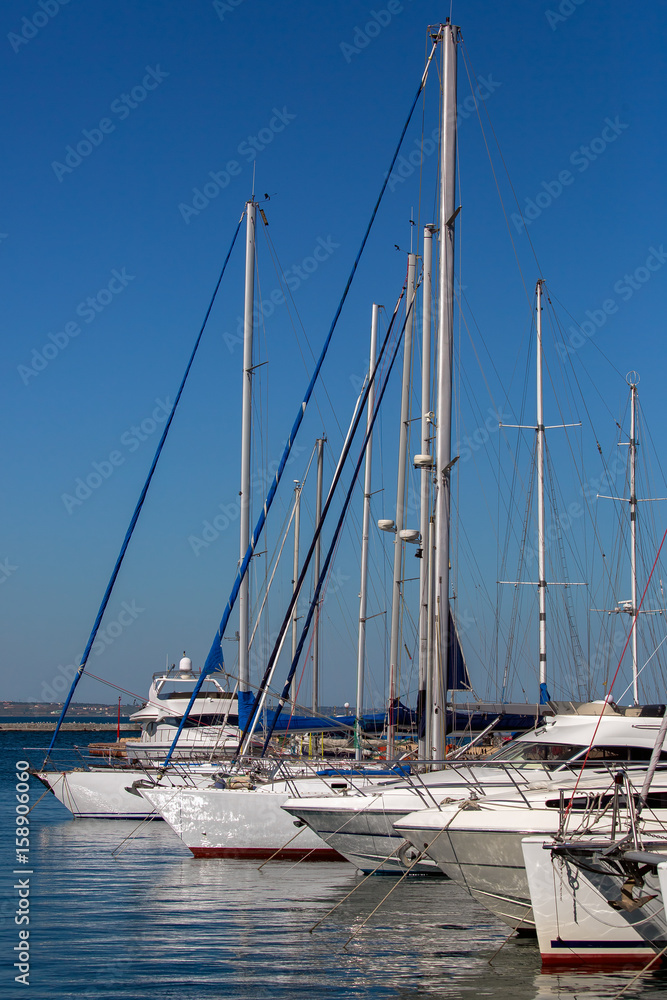  yachts moored  in a marina.