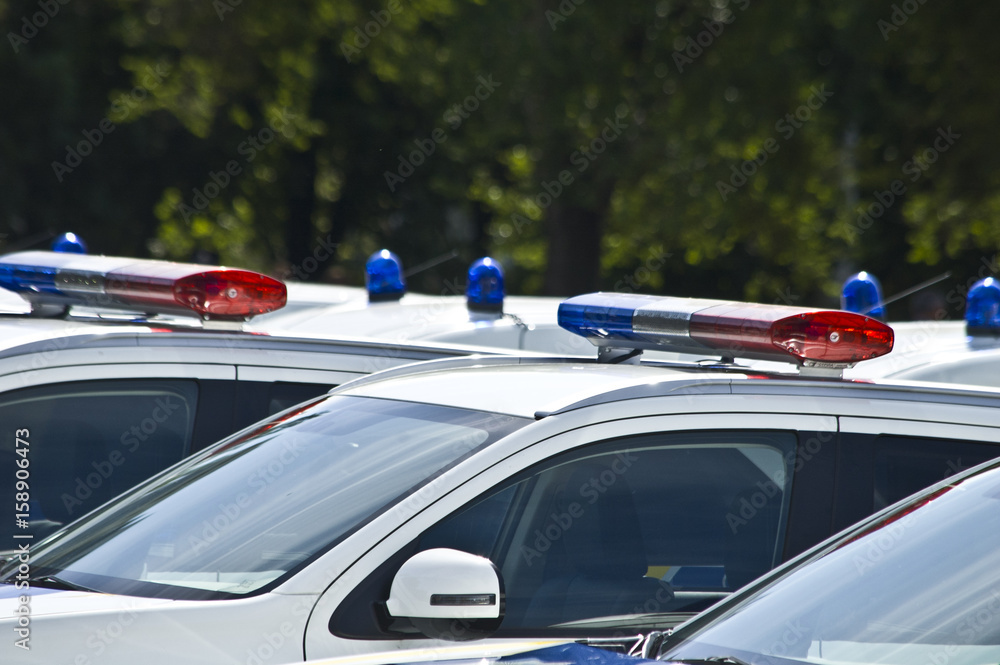 Police cars with red and blue color sirens