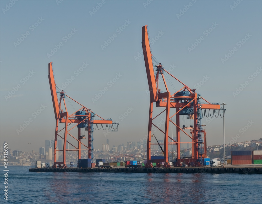 Day shot of the cranes in the shipyard of the Port of Haydarpasha, Istanbul, Turkey with city view in the background