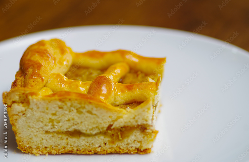 Delicious homemade pineapple cake over a white plate Delicious homemade pineapple cake over a white plate