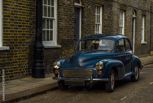 Wallpaper Mural Old blue car parked on the street, old london, old building in london Torontodigital.ca