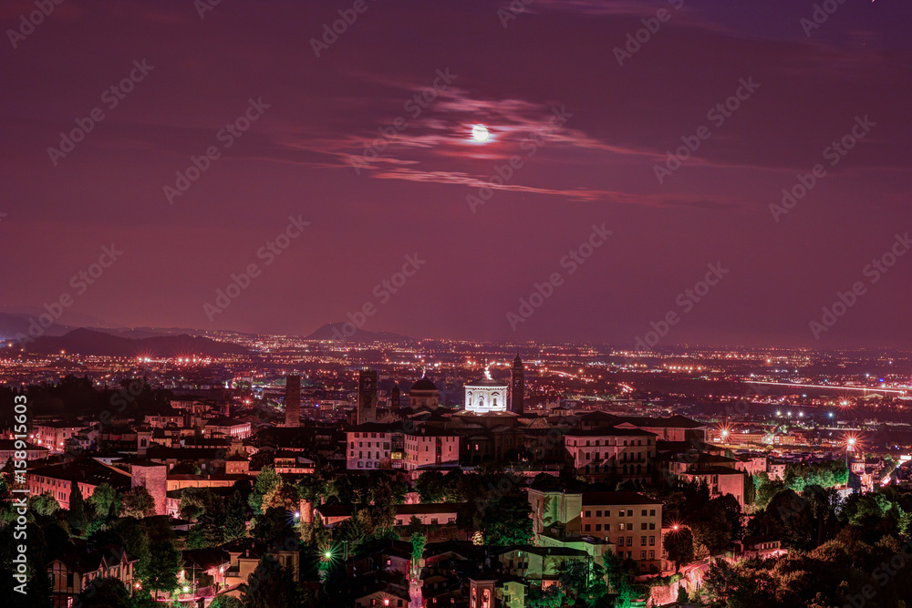 Fototapeta premium View at Old Town Citta Alta of Bergamo from San Vigilio Hill. Bergamo, Italy. Night view.