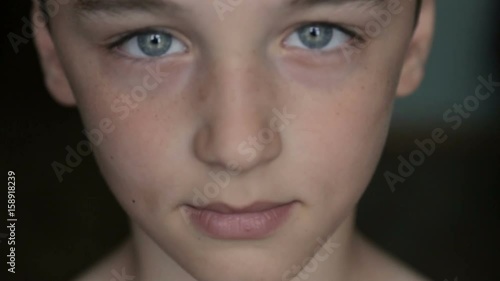 Child portrait, boy looks at the camera