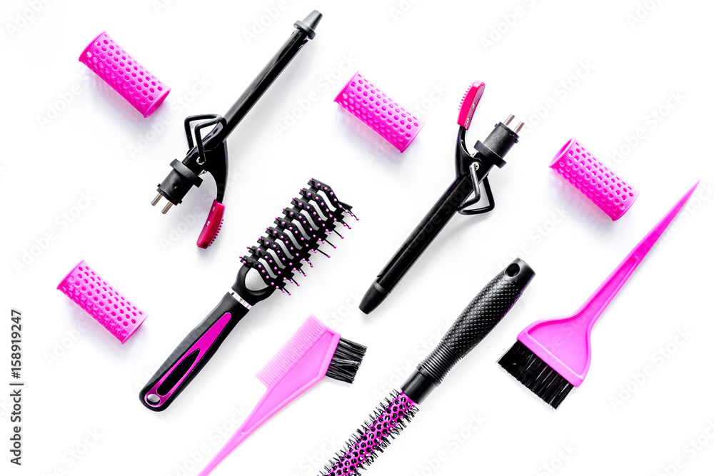 Hairdressing tools compositoin on white background top view