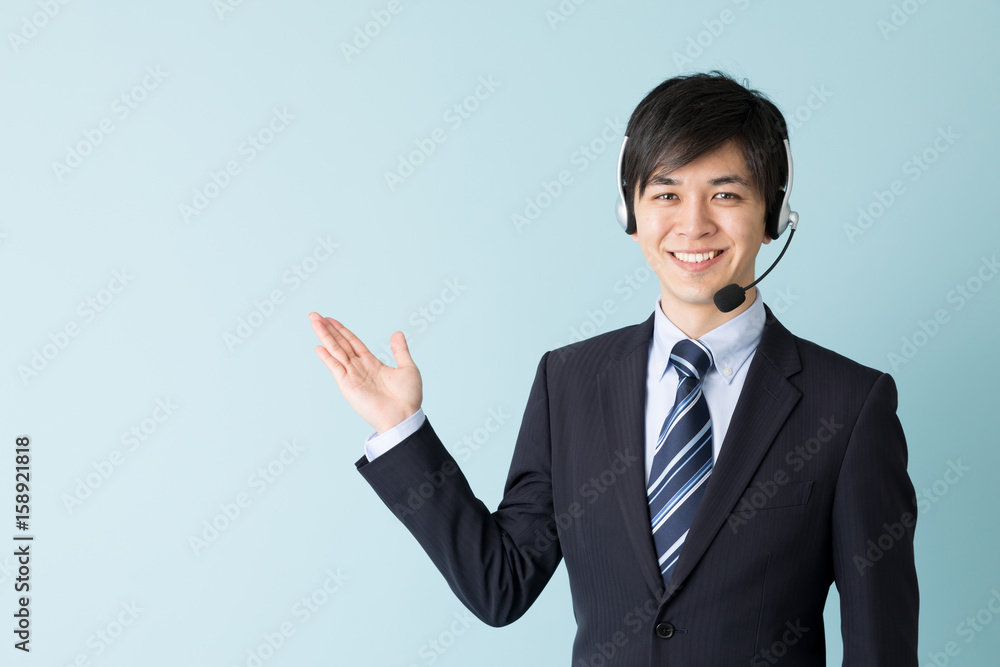 portrait of asian businessman isolated on blue background portrait of asian businessman isolated on blue background
