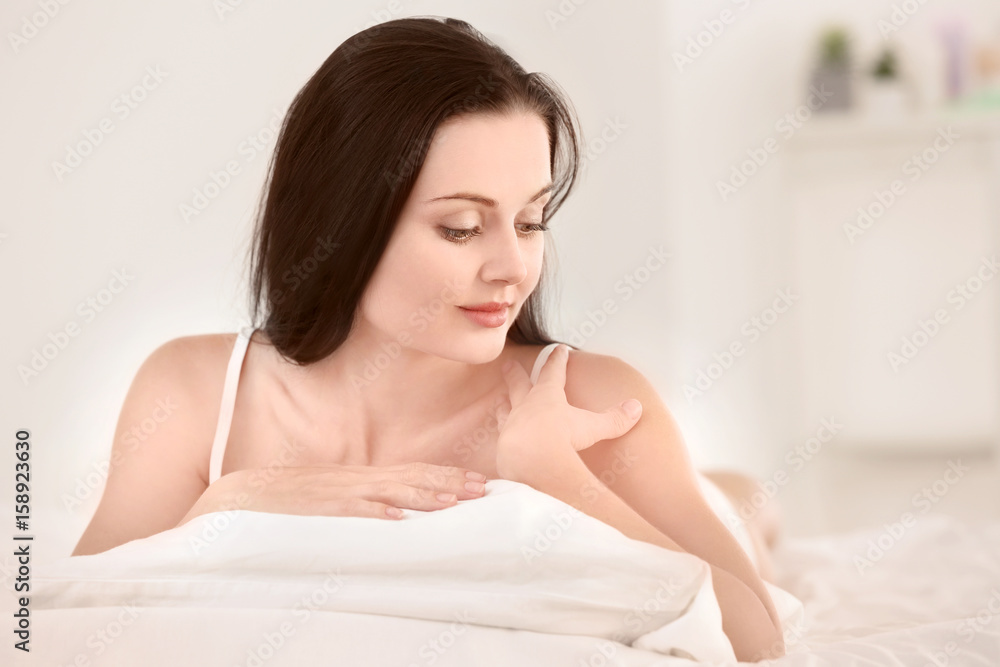 Portrait of beautiful young woman in bedroom Portrait of beautiful young woman in bedroom