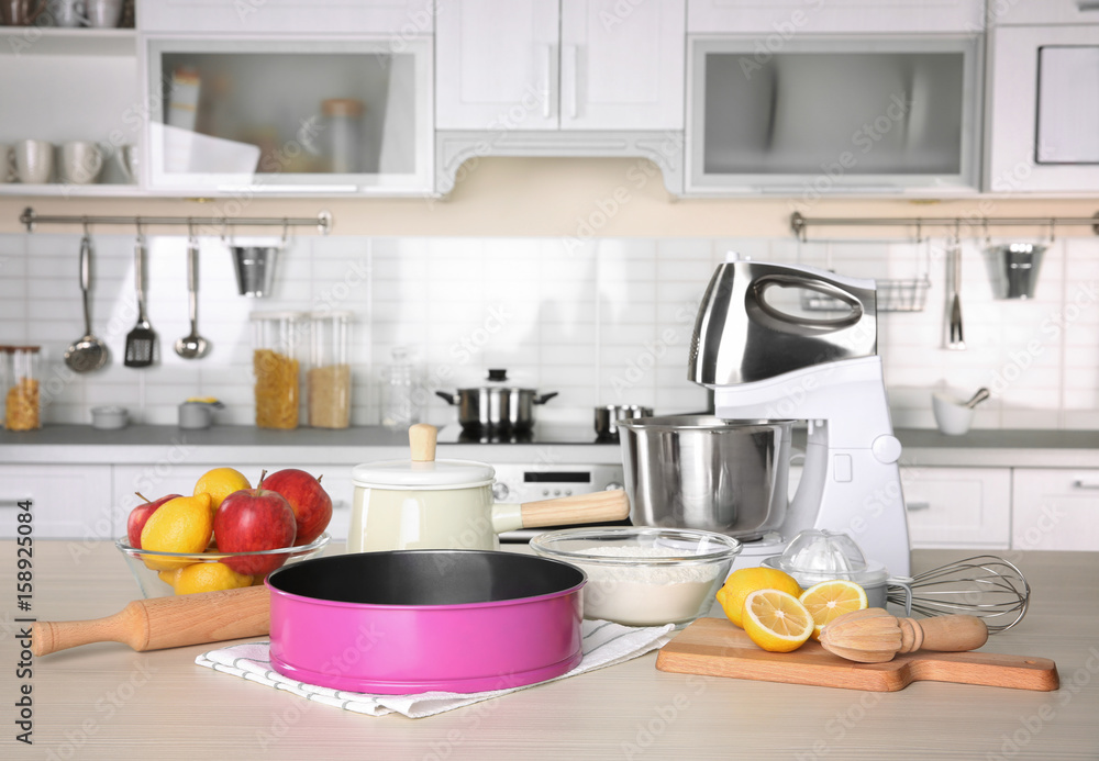 Kitchenware for cooking classes on wooden table Kitchenware for cooking classes on wooden table