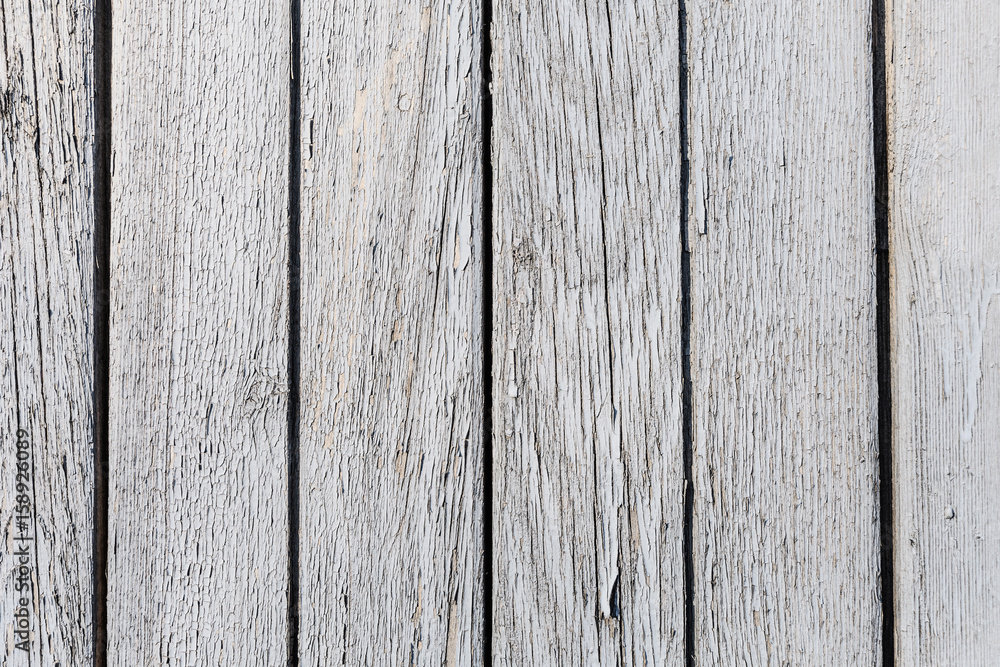 Wooden lilac boards which are faded and peeling paint Wooden lilac boards which are faded and peeling paint