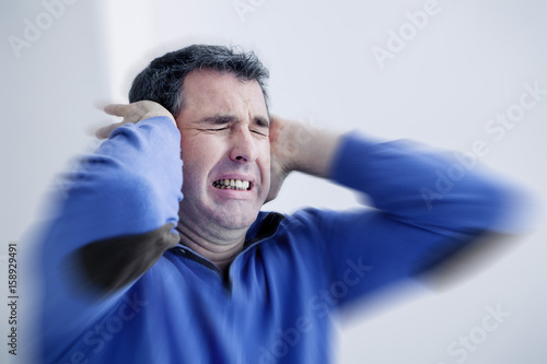 Man suffering from earache photo