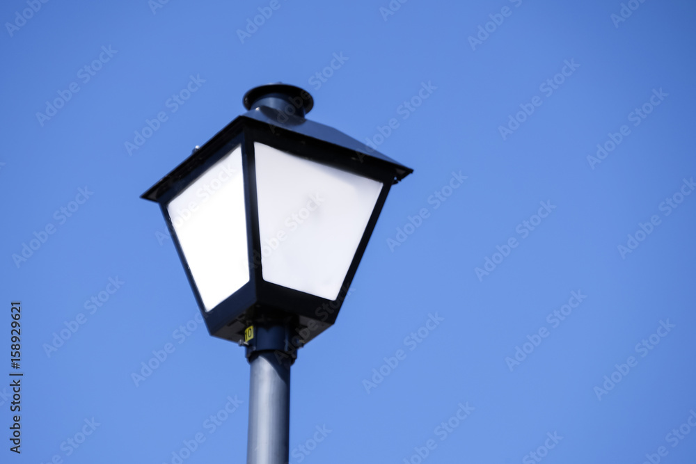 street light against blue sky