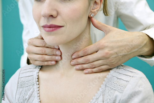 Thyroid palpation, woman photo