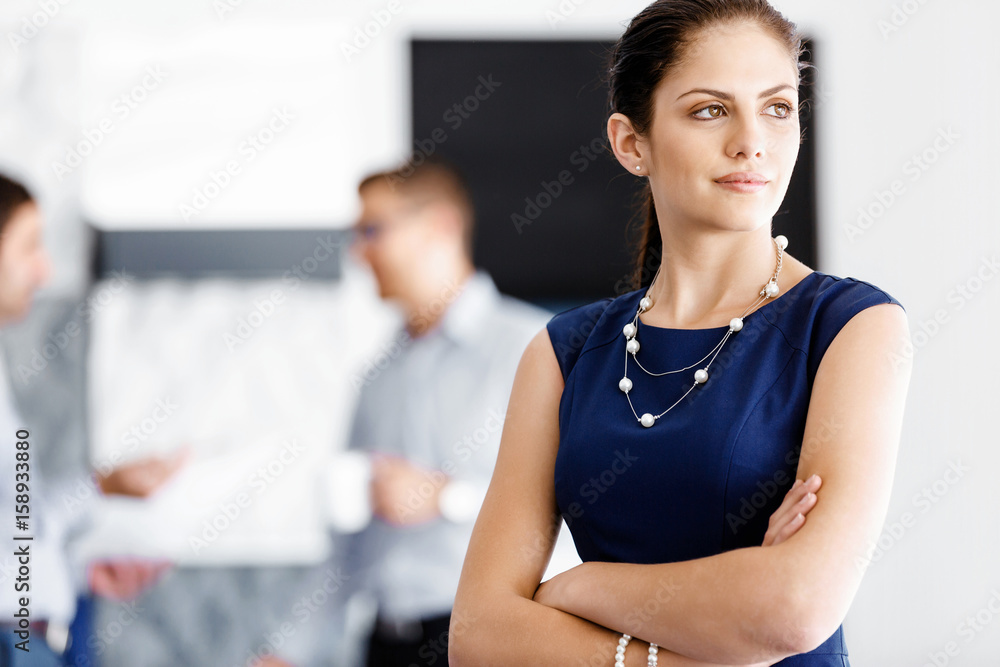 Attractive office worker standing Attractive office worker standing