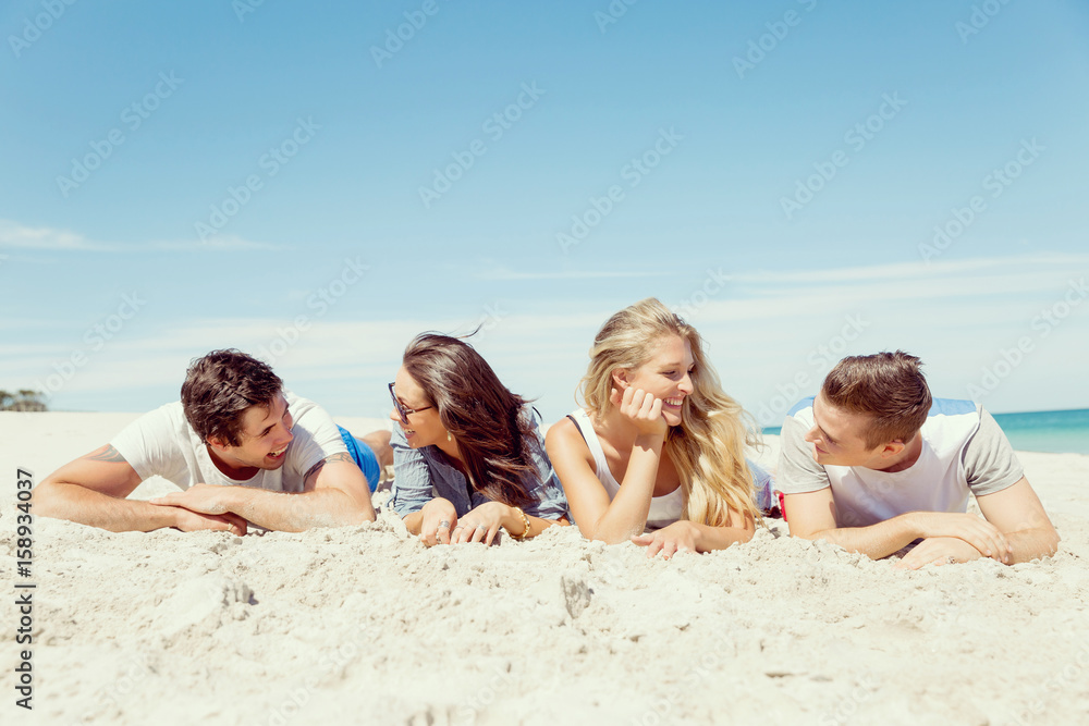 Company of young people on the beach