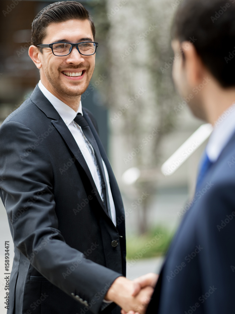 Two businessmen shaking their hands Two businessmen shaking their hands