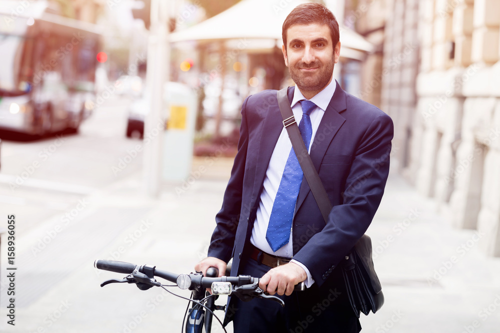 Young businessmen with a bike Young businessmen with a bike