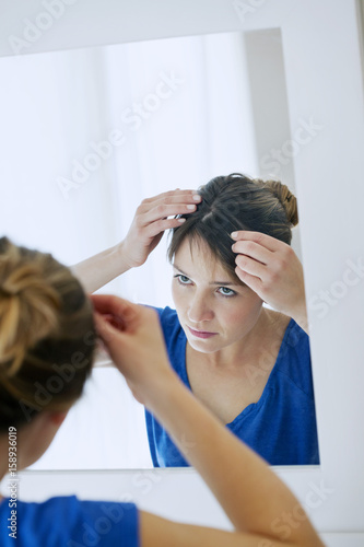 Woman looking in a mirror