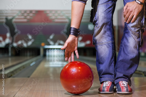 the hand throws the bowling ball