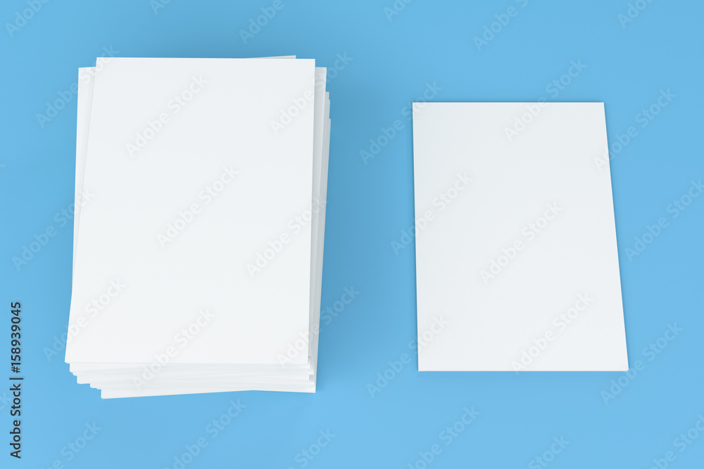 Stack of blank white closed brochure mock-up on blue background Stack of blank white closed brochure mock-up on blue background