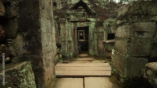 Preah Khan ancient temple in Angkor Wat area, smooth tracking first person shot photo