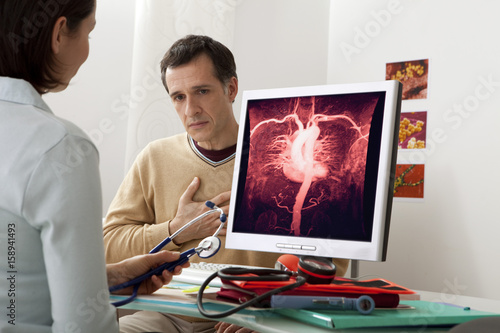 Models On screen, cardiac angiography (healthy) photo
