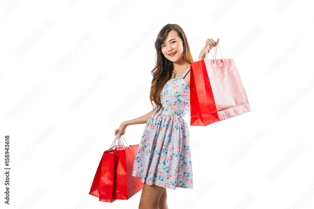Beautiful happy woman with shopping bags on a white background.