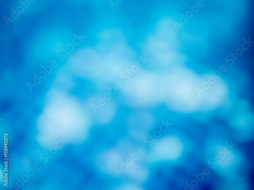 the abstract background of natural light bokeh from blue water