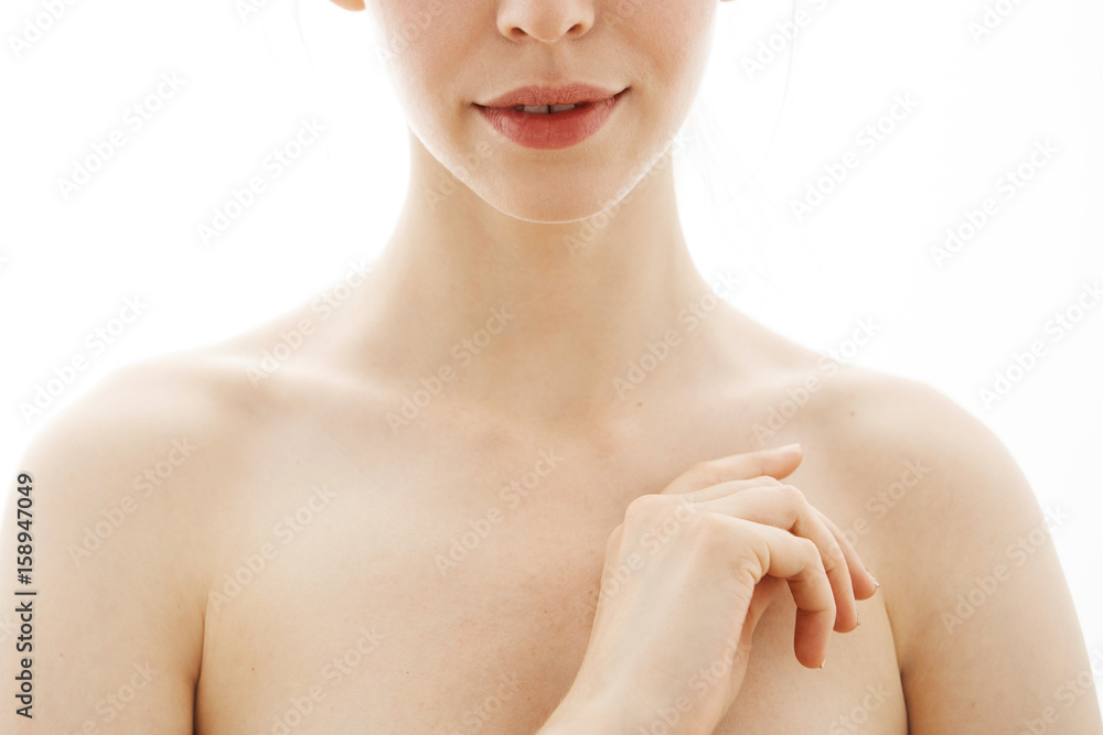 Close up of young beautiful tender nude girl over white background. Copy space. Close up of young beautiful tender nude girl over white background. Copy space.