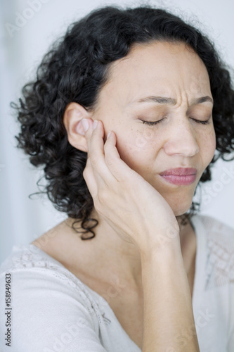 Woman suffering from earache