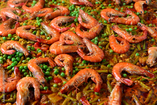 Paella with seafood and chicken. Prepared in wok.