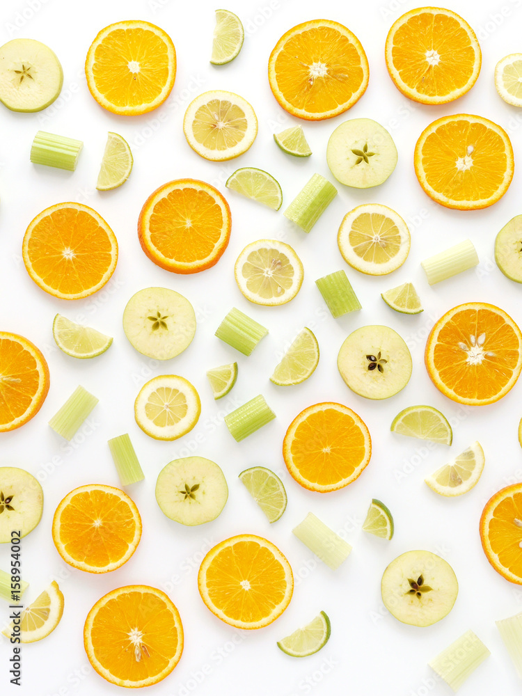 Orange slices and apples on a white background. Fruit pattern. Abstract food background. Top view.