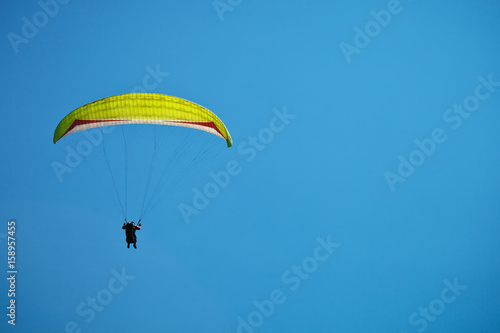 Paragliding along beautiful coastline.