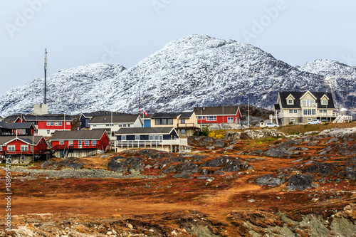 Living Inuit houses among the rocks and  mountain in the background Nuuk, Greenland