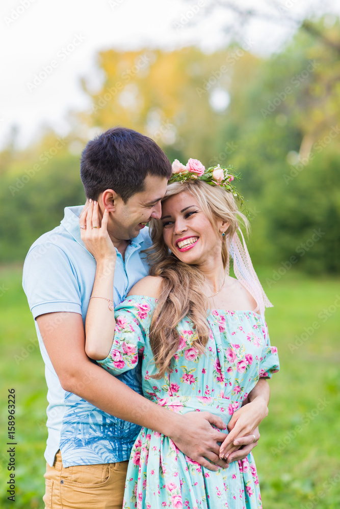 Fototapeta premium happy young couple hugging on nature