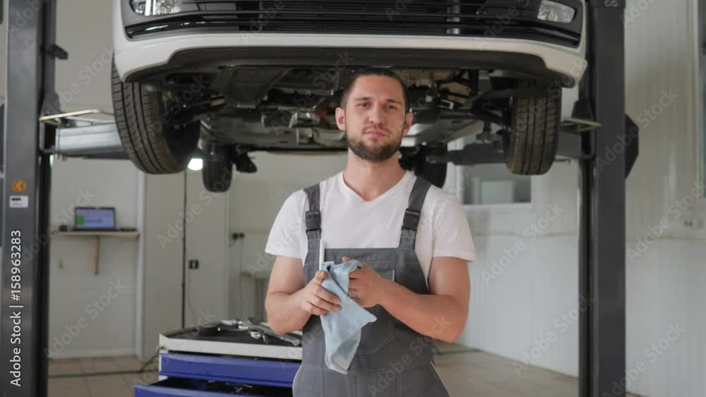 automobile service, portrait master on background repair on Hydraulic ...