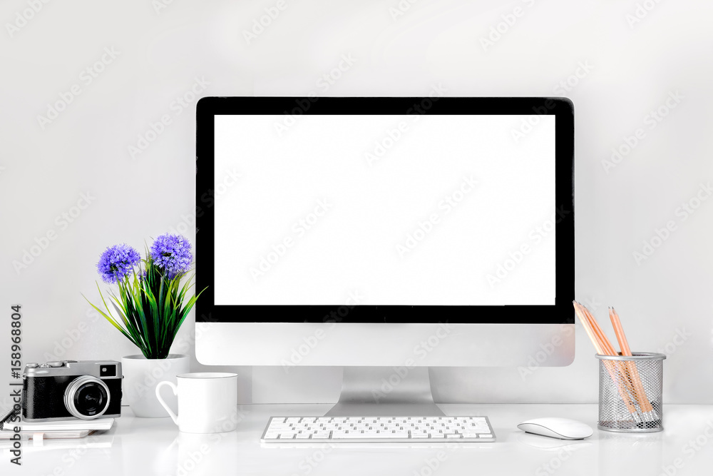 Fototapeta premium Comfortable workplace with modern desktop computer. Blank screen for graphic display montage..