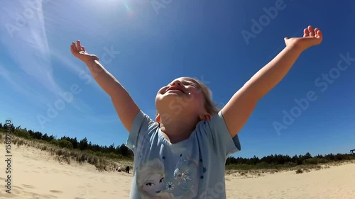 Wallpaper Mural Little Girl Reaching The Sky Hands Praying Smiling on Sunny Beach Torontodigital.ca