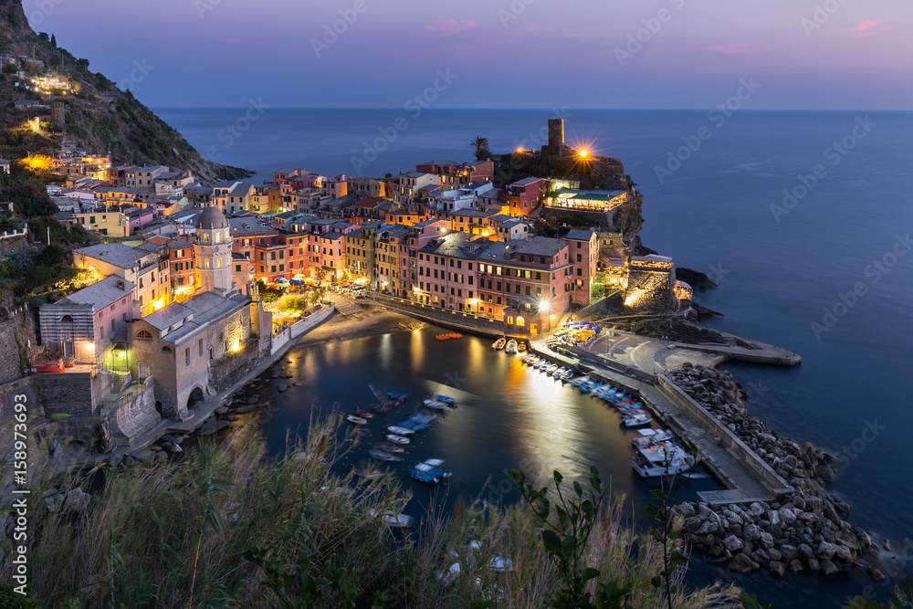 View from high hill of Vernazza houses and blue sea, Cinque Terre national park, Liguria, Italy