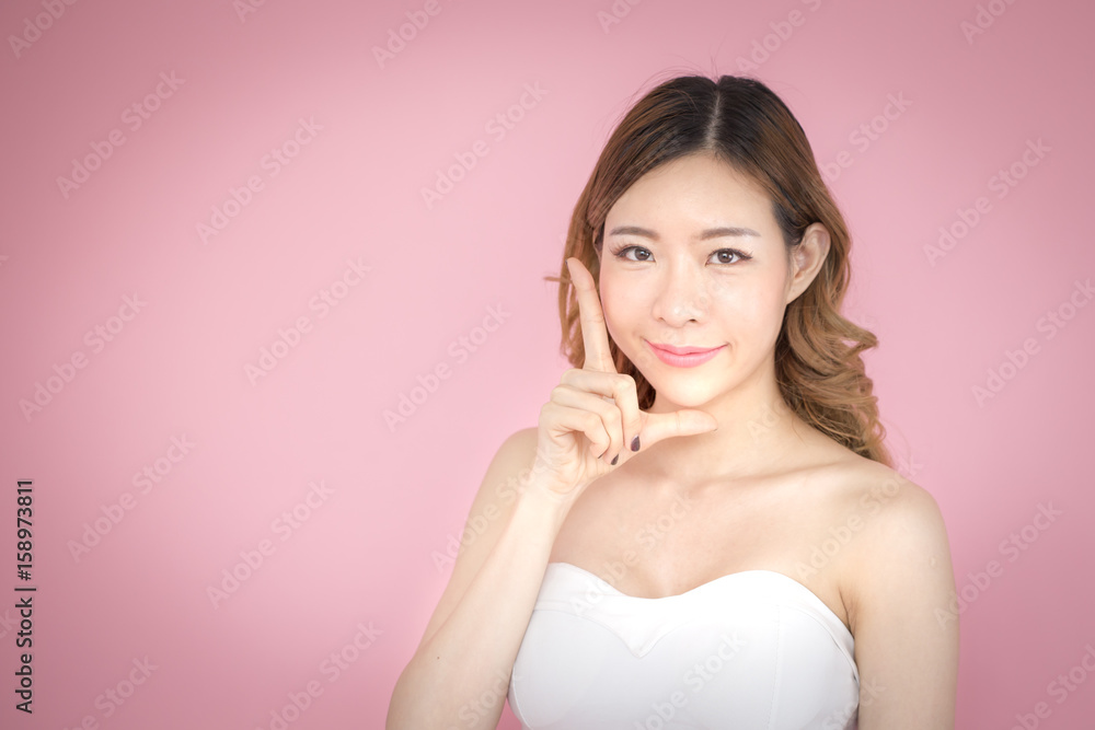 Beautiful korea woman posing with face and skin concept, isolated on pink background, 20-30 year old. Beautiful korea woman posing with face and skin concept, isolated on pink background, 20-30 year old.