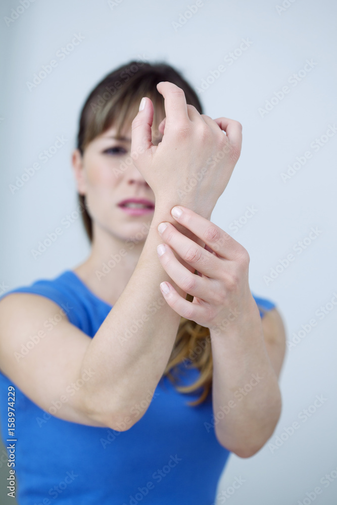 Woman suffering from wrist pain Woman suffering from wrist pain