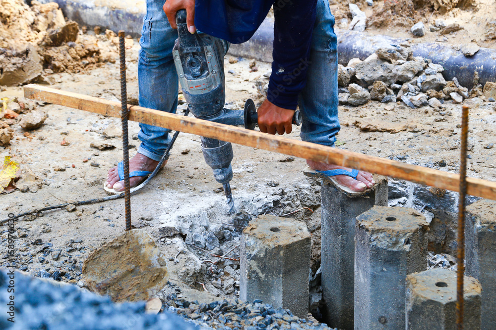 worker man mason drilling cement concrete floor with machine worker man mason drilling cement concrete floor with machine