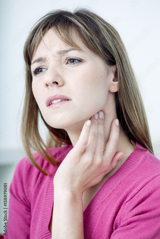 Woman suffering from sore throat Woman suffering from sore throat